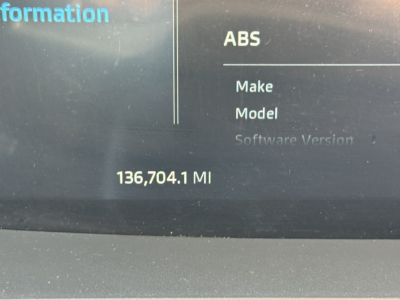 Dashboard display showing ABS Software Version field with 136,704.1 MI mileage in a Kenworth T680 truck information screen.