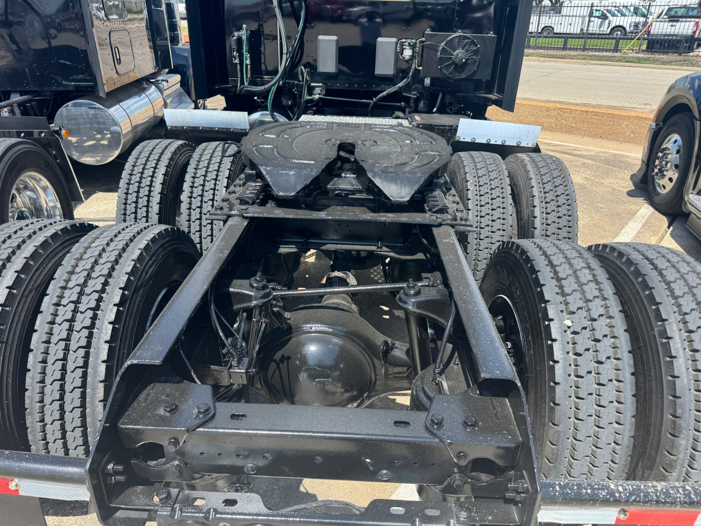Kenworth T680 chassis view showing rear dual axle setup and fifth wheel mount.