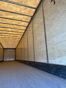 Trailer interior showing empty cargo area with sidewalls and roof ribs in a Wabash van trailer.