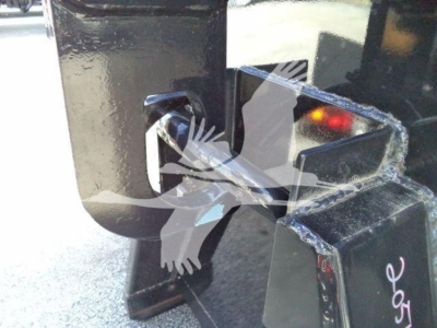 Isuzu NPR-HD truck hitch/receiver and metal frame showing hitch mount with pin and surrounding support structure.
