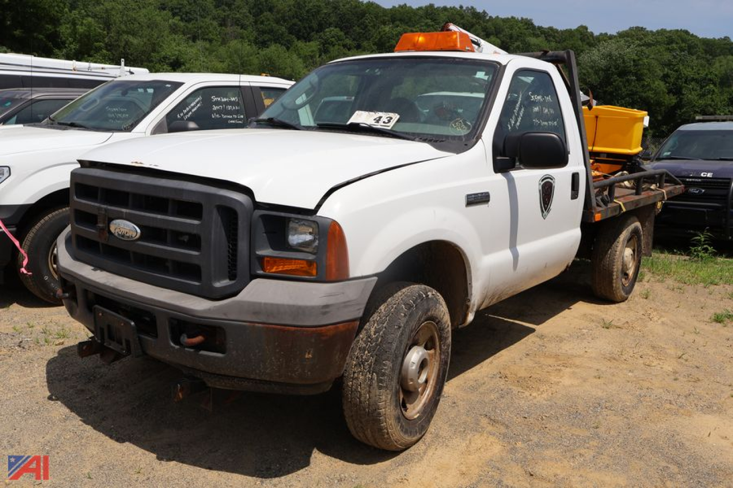 Ford F-250 Super Duty pickup with plow and salter, white, front-left view, utility body, 4x4, used vehicle.