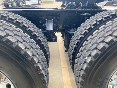 Mack AN64T truck rear chassis showing dual rear axles with heavy-duty tires and suspension components.