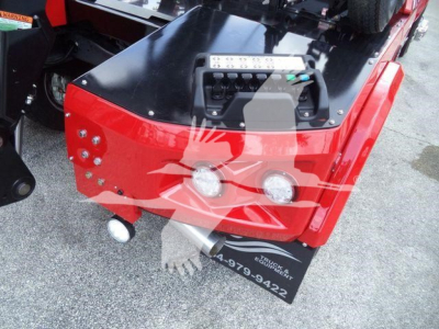 Ram 5500 winch-equipped truck rear end showing winch control panel, two round lights, and license plate area.