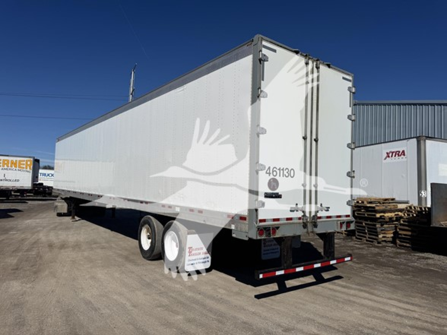 Great Dane 2014 sheet-and-post dry van trailer rear view showing closed double doors, swing latches, two axles, and reflective taillights.