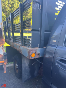 Truck bed showing stake bed with metal rails on a 2004 Chevrolet Silverado 2500HD stake truck.
