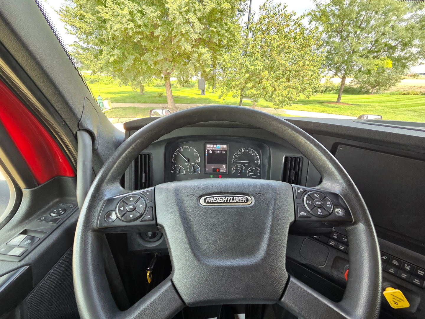 Freightliner PT126064S PT126064S dashboard view showing steering wheel with Freightliner emblem, instrument cluster, and dashboard controls.