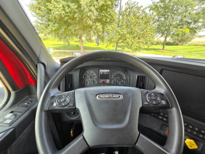 Freightliner PT126064S PT126064S dashboard view showing steering wheel with Freightliner emblem, instrument cluster, and dashboard controls.