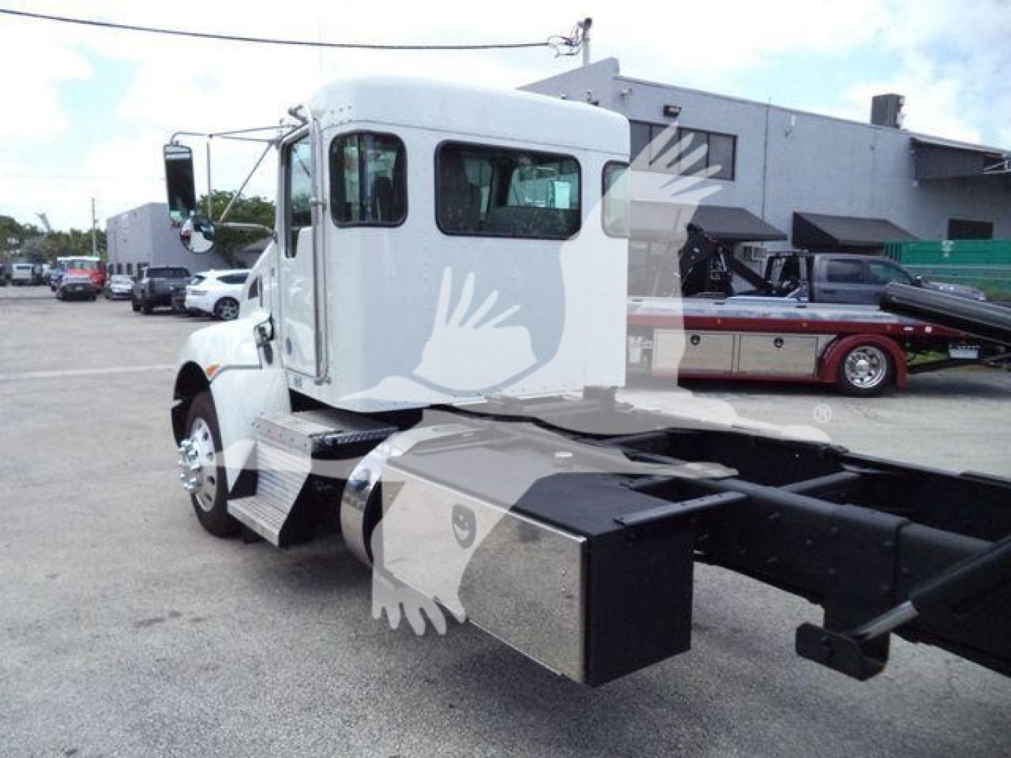 Kenworth T270 rollback truck cab and chassis showing side view with fuel/air tanks and storage boxes.