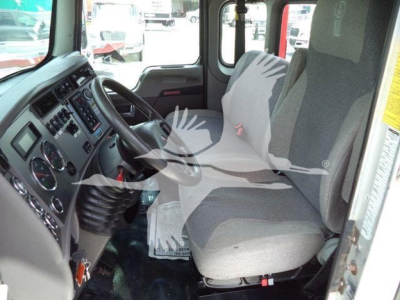 Truck cab interior of a 2019 Kenworth T270 rollback showing driver seat and dashboard with steering wheel and controls.