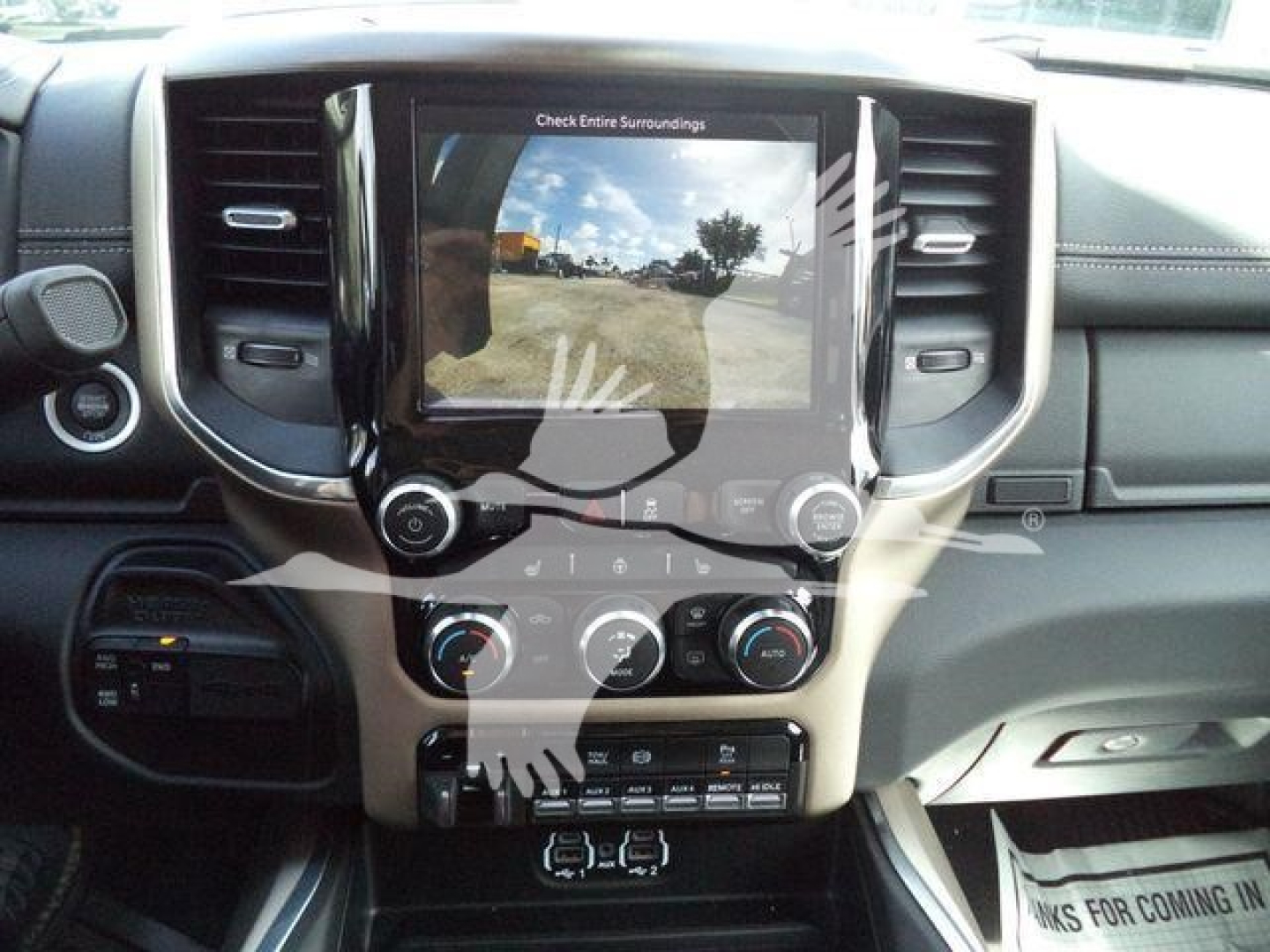 Ram 5500 interior centered on touchscreen display with gauges and climate controls.