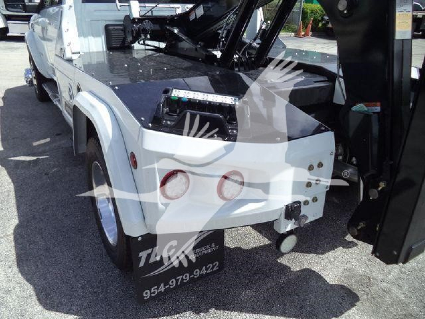 Truck winch setup on Ram 5500 rear with dual round taillights and mounted winch components visible.
