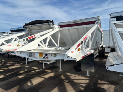 Dump trailer showing Ranco LW21-40 with white steel frame and tri-fold hydraulic tailgate, side markers, and label decals.