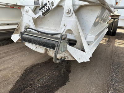 Dump trailer hitch/ rear frame showing hydraulic hose and coupling on a Ranco LW21-40 trailer.