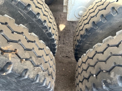 Ranco LW21-40 dump trailer wheels close-up showing dual tires and tread pattern.
