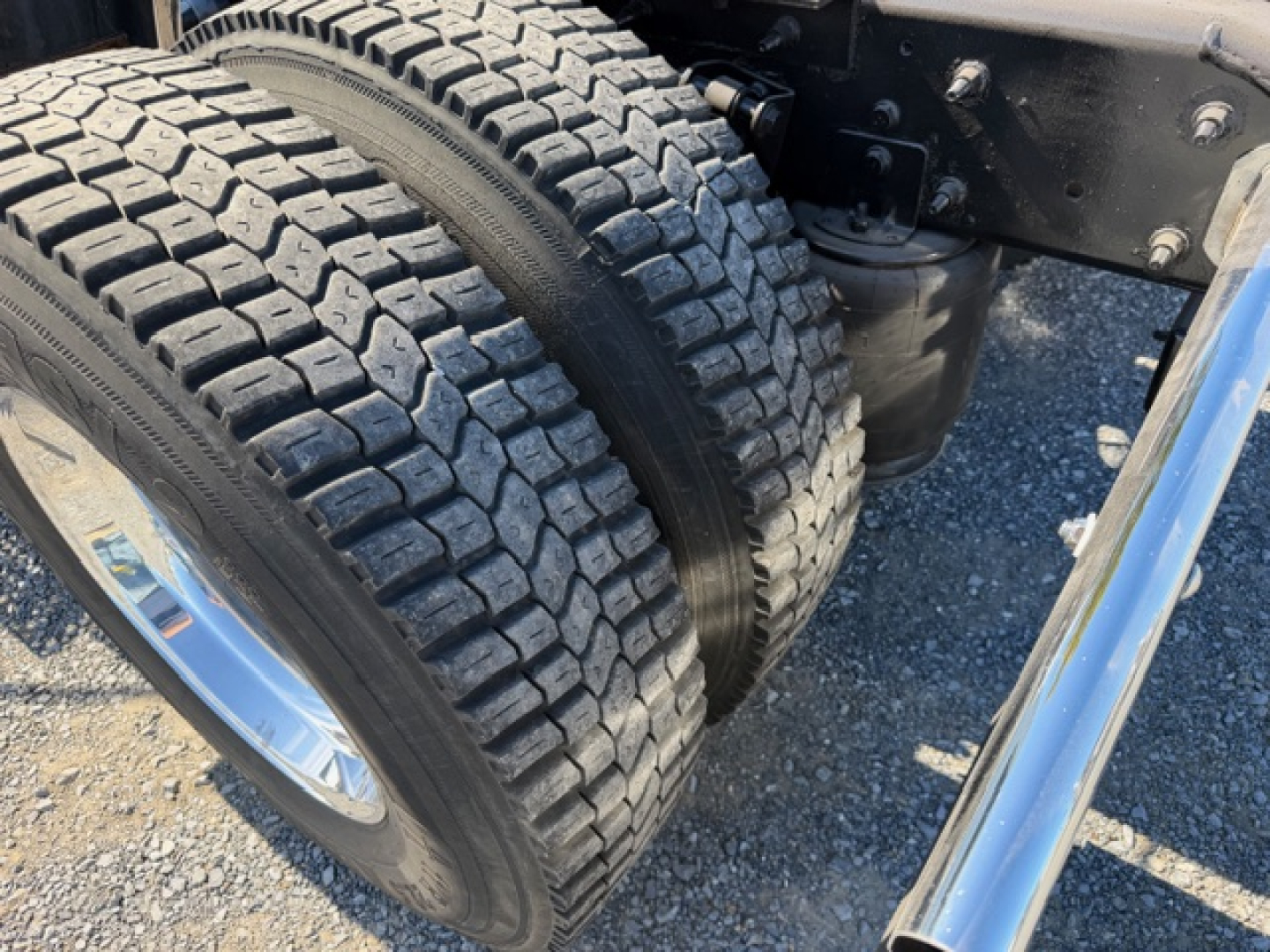 Dual rear truck tires mounted on a 2018 International LT625 conventional daycab showing tread pattern and wheel assembly.