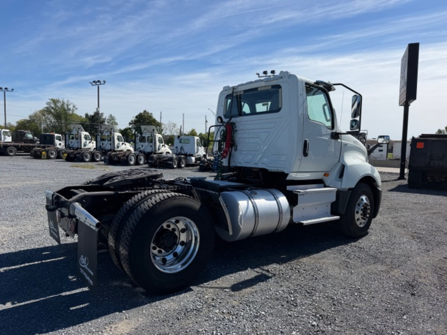 Truck chassis and cab of a used 2018 International LT625 daycab seen from rear side, with fifth wheel and dual rear axle area visible.
