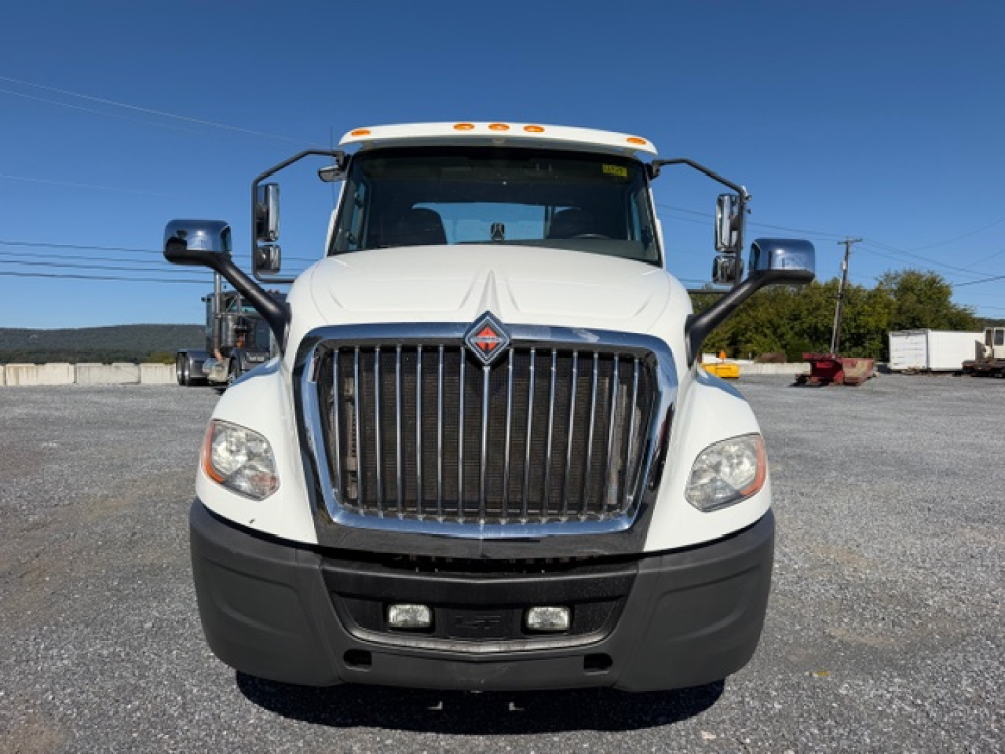 International LT Series truck front view showing grille, headlights, and bumper.