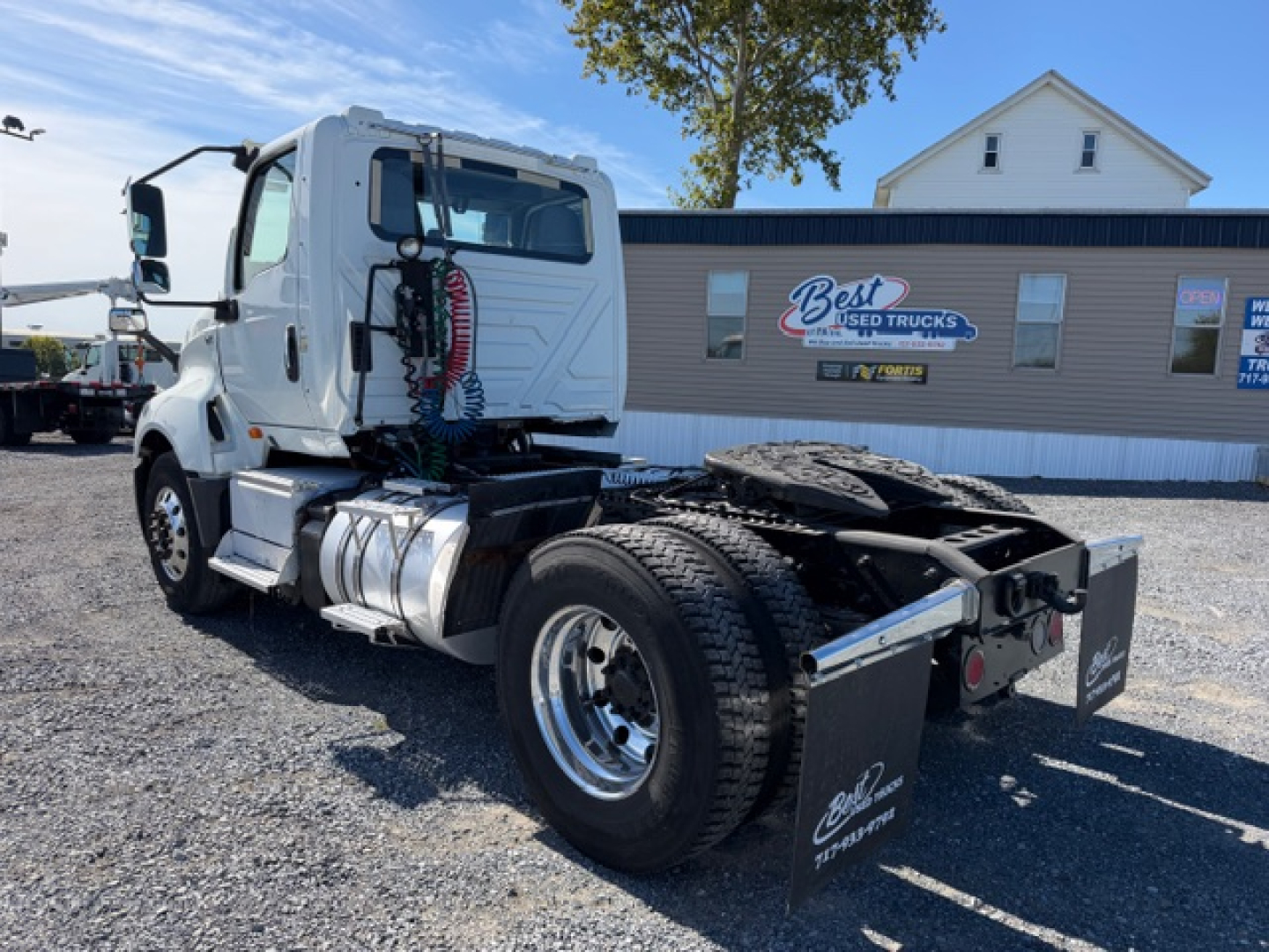 Truck chassis view of 2018 International LT625 daycab showing rear chassis and dual rear wheels with fifth wheel and air lines.