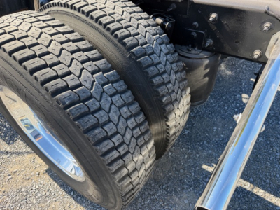 Dual rear truck tires mounted on a 2018 International LT625 conventional daycab showing tread pattern and wheel assembly.