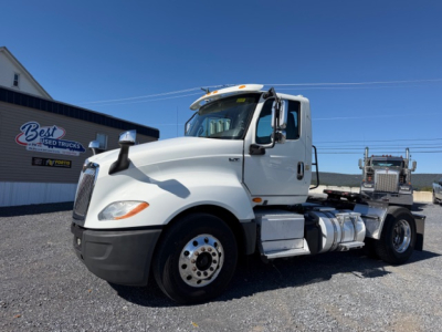 Truck cab and chassis of a 2018 International LT625 tractor in a used truck lot.