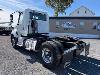 Truck chassis view of 2018 International LT625 daycab showing rear chassis and dual rear wheels with fifth wheel and air lines.