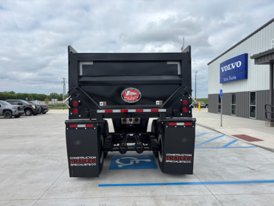 Dump trailer back view showing CTS HRD-32 with black dump body and dual rear taillights, logo badge, and mud flaps reading CONSTRUCTION TRAILER SPECIALISTS.