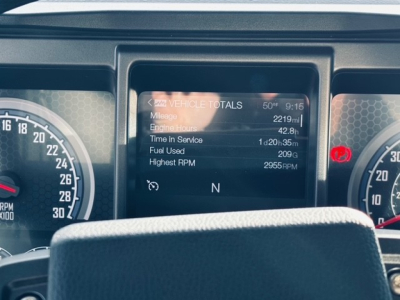 Dashboard display showing vehicle totals: Mileage 2219 mi, Engine Hours 42.8 h, Time In Service 1 d 20 h 35 m, Fuel Used 209 gal, Highest RPM 2955 RPM. N gear shown.