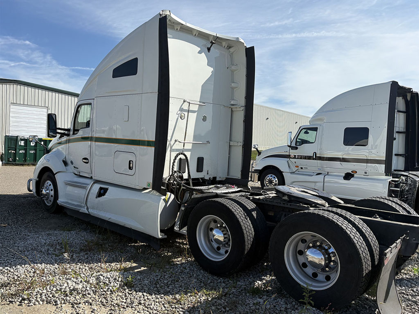 Kenworth T680 semi tractor in a used condition, side view showing sleeper cab and dual rear axles, VIN 1XKYD49X0KS221159 visible on listing.