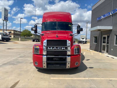 Mack AN64T70 conventional sleeper truck front view showing red cab and chrome grille with Mack logo