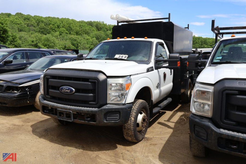Ford F-Series Super Duty utility truck in a lineup showing front grille, cab, and utility bed; visible text includes Ford emblem and truck number 368 on windshield.