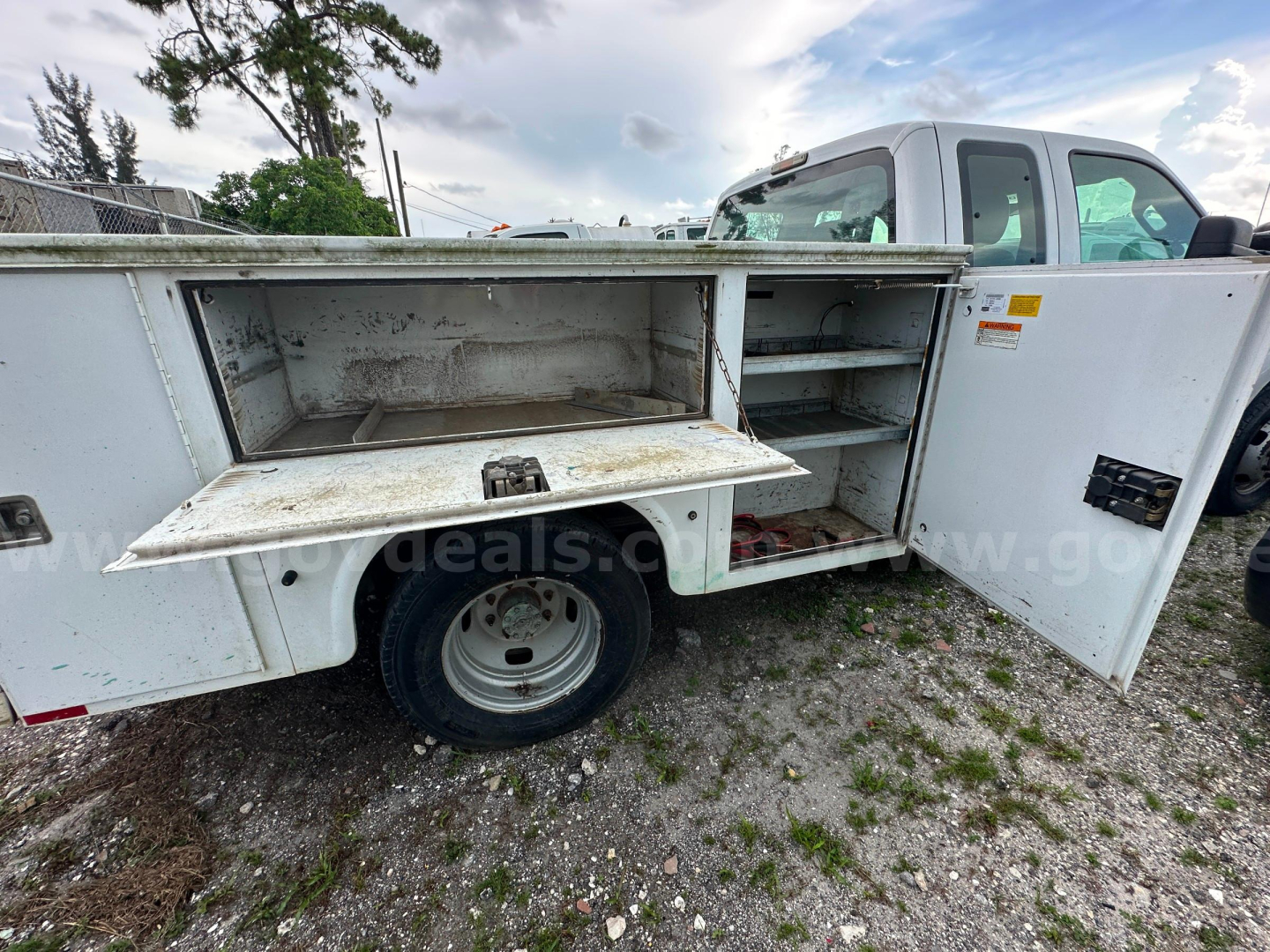 Service/utility truck bed compartments with open tool/storage boxes