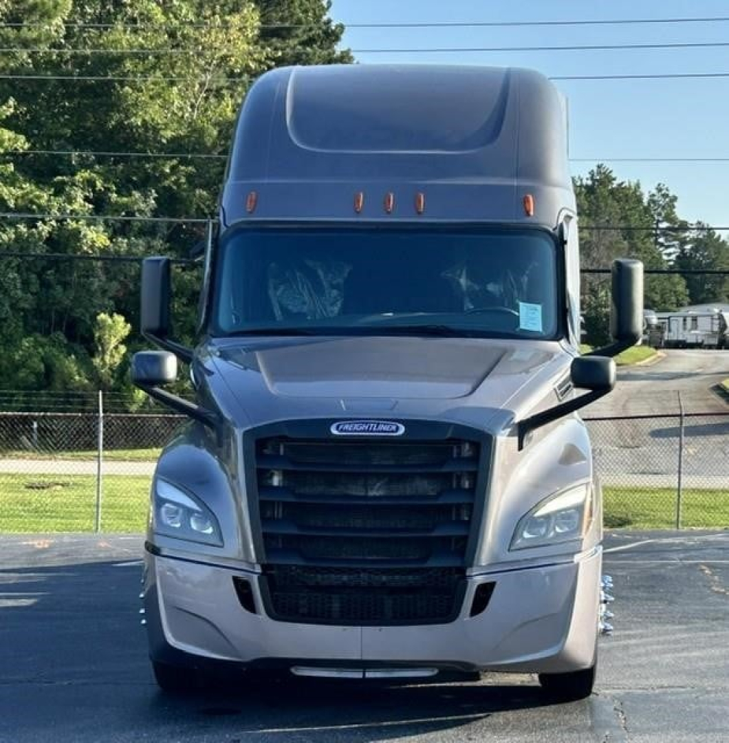 Freightliner Cascadia 126 truck front view showing grille, headlights, and tall sleeper cab.