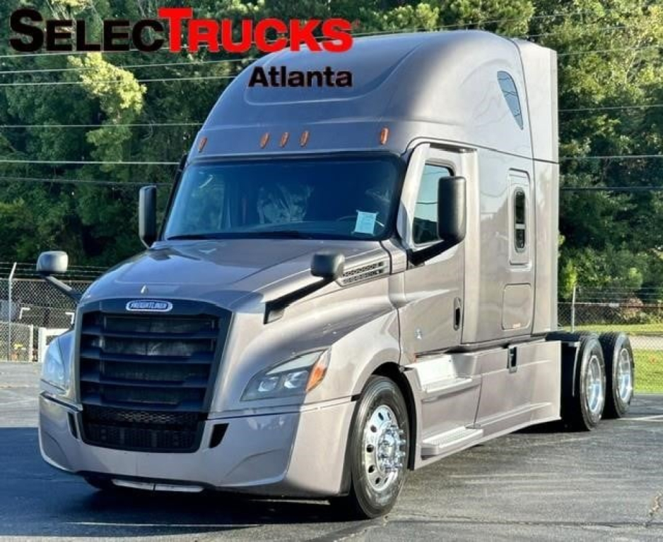 Freightliner Cascadia 126 tractor in silver/gray with sleeper cab, front grille and headlights visible, SelectTrucks Atlanta logo overlay.