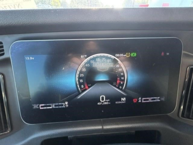 Dashboard display of a 2023 Freightliner Cascadia showing speedometer readout with digital gauges and warning icons.