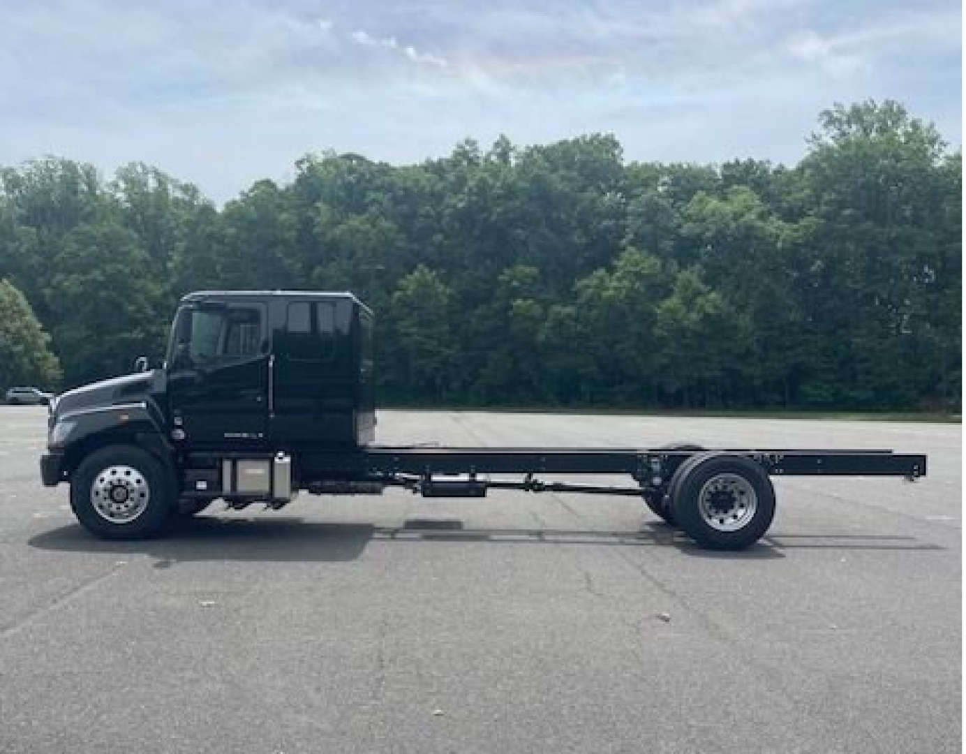 2027 Hino L7 cab chassis truck side view showing long flatbed and dual rear wheels.
