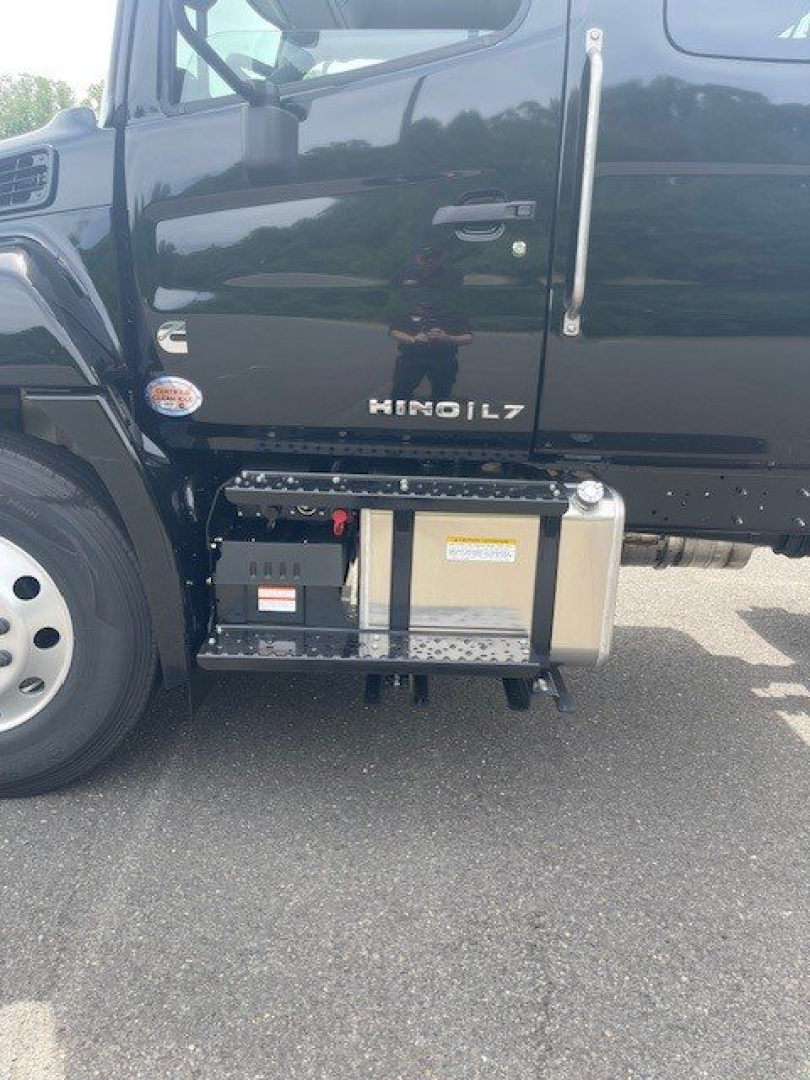 Hino L7 cab chassis side view showing fuel/air filter canister and underbody components