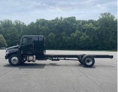 2027 Hino L7 cab chassis truck side view showing long flatbed and dual rear wheels.