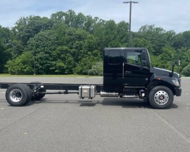 Truck chassis showing cab and frame with fuel tank and side view, 2027 Hino L7 listing