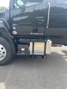Hino L7 cab chassis side view showing fuel/air filter canister and underbody components