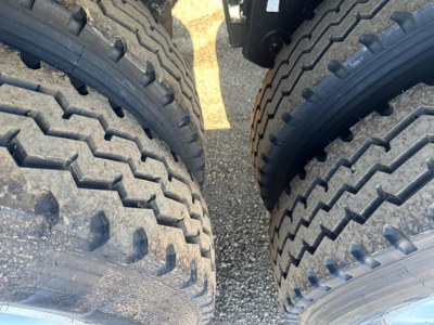 Front close-up of dual tires on a Jet 40' Air Ride Side Dump trailer showing tread patterns.