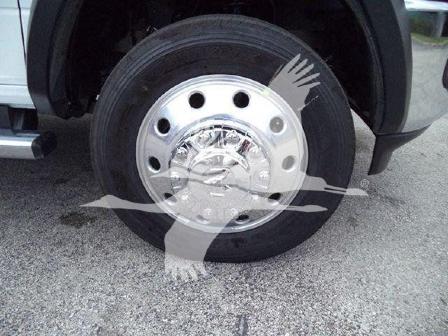 Ram 4500 wheel and hub view with polished steel rim and tire, partial fender and wheel well visible.