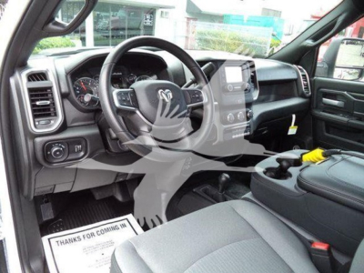 Ram 4500 SLT interior view showing steering wheel, dashboard, center console, and front seats.