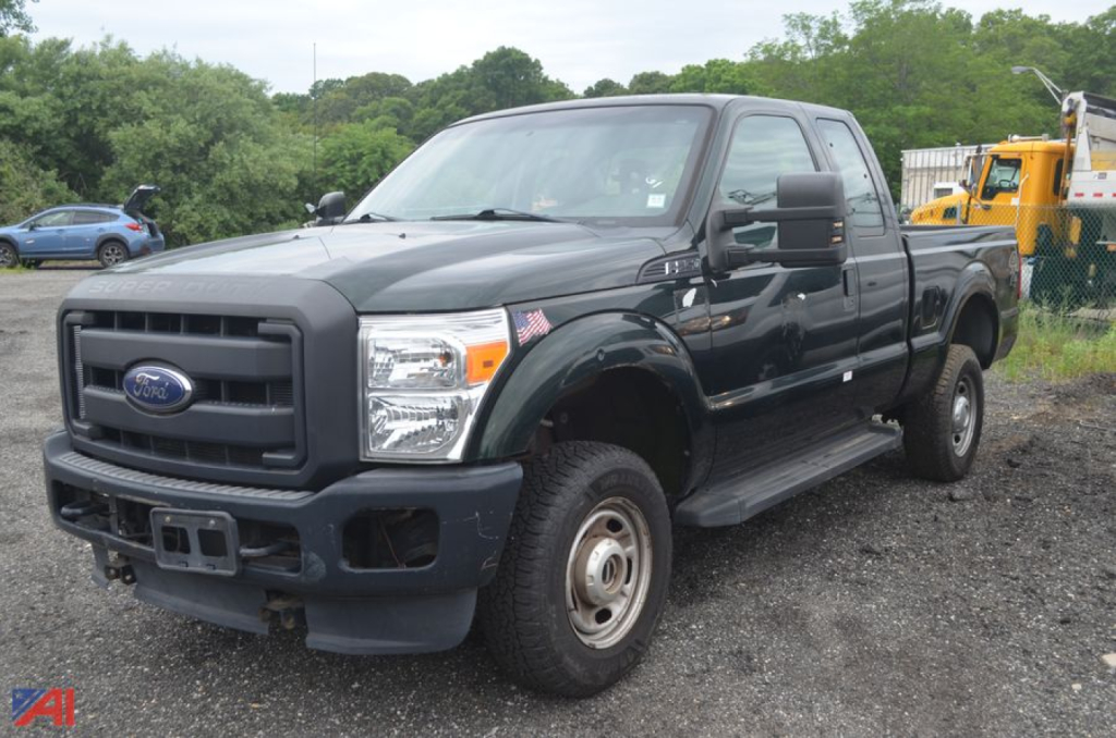 Ford F-250 pickup truck with extended cab, black exterior, front grille, large bumper, running boards, and dual rear wheels visible.