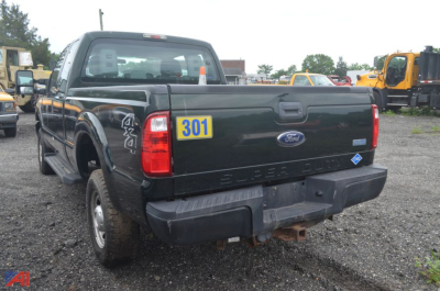 Ford F-250 Super Duty pickup rear view with tailgate, bumper, and a blue 301 sticker on the tailgate.