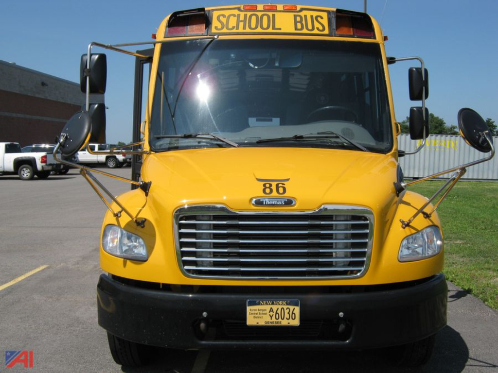 Front view of a yellow 2017 Freightliner C2 school bus with 'SCHOOL BUS' sign, number 86, chrome grille, and New York license plate.