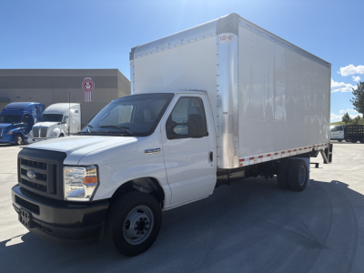 Ford E-350 box truck in view showing cab and large cargo box, side profile, white exterior, dealership lot background.