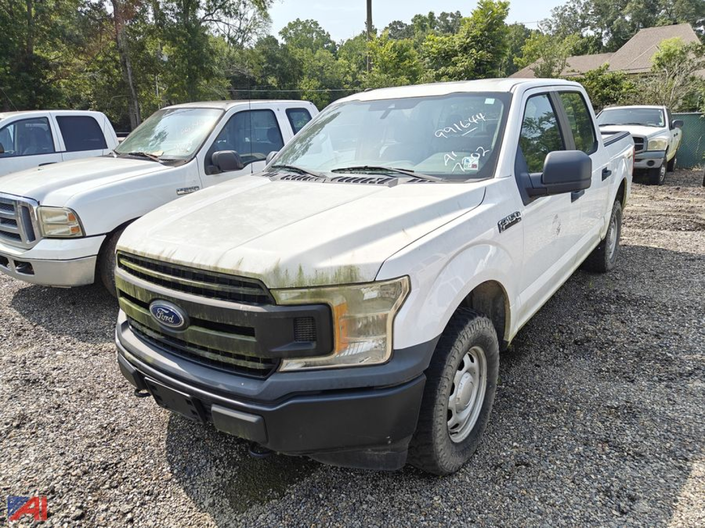 Ford F-150 pickup truck crew cab 4x4 in beige color with black bumper and grille, front angled view