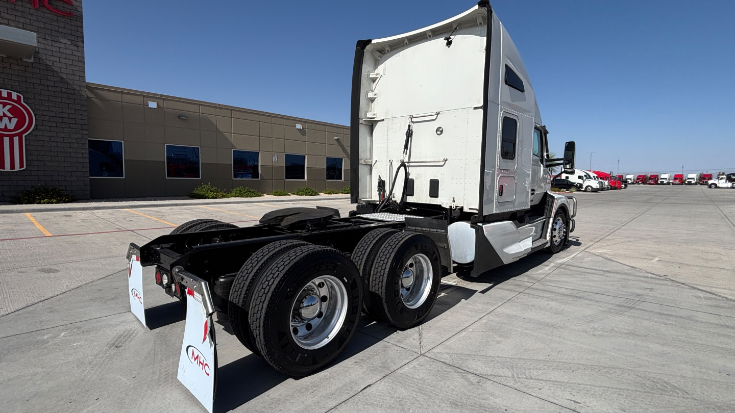 Kenworth T680 truck in view from rear-left showing tractor with sleeper cab and dual rear axles.