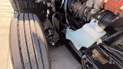 Kenworth T680 engine bay with coolant reservoir and turbo intake visible