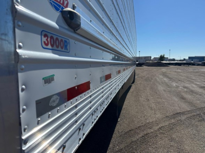 Trailer side showing 3000R logo and reflective markings on a reefer trailer in a lot.